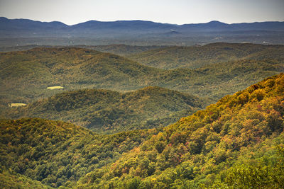 High angle view of land and mountains against sky