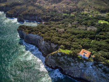 San emeterio lighthouse, coastline landscape in the surroundings of the cave of the pindal, asturias