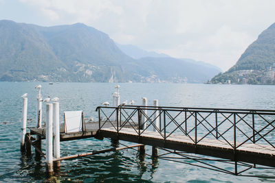 Scenic view of sea and mountains against sky