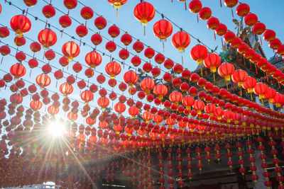 Low angle view of lantern against sky