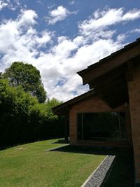 Buildings against cloudy sky