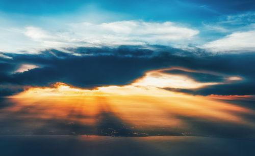 Low angle view of dramatic sky during sunset