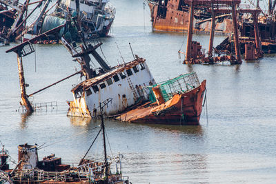 Boats moored at harbor