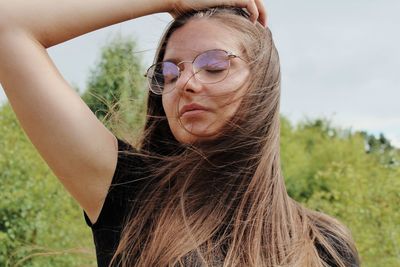 Portrait of young woman with eyes closed