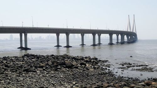 Bridge over sea against sky