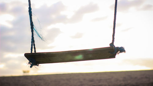 Close-up of rope on land against sky