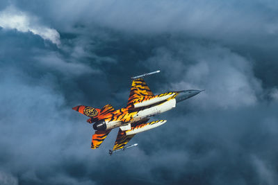 Low angle view of airplane flying in sky