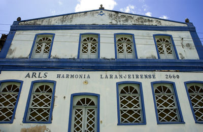 Low angle view of building against blue sky