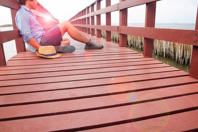 Young man on jetty