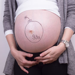 High angle view of pregnant woman standing at home