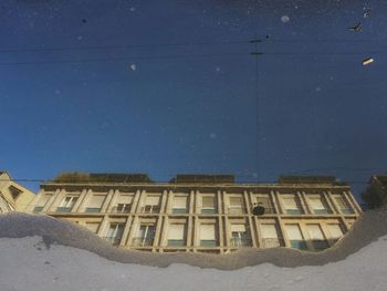 Low angle view of built structure against blue sky