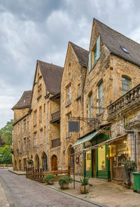 Street amidst buildings against sky