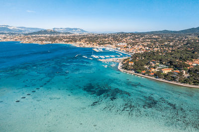 High angle view of sea against blue sky