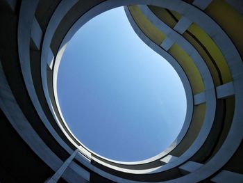 Low angle view of built structure wirh shape of waterdrop against clear blue sky