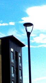 Low angle view of building against blue sky