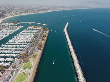 High angle view of sea and buildings in city