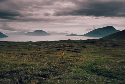 Scenic view of landscape against dramatic sky