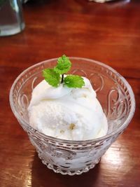 Close-up of ice cream served on wooden table