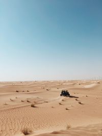 Scenic view of desert against clear sky