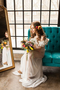 Woman holding flower bouquet