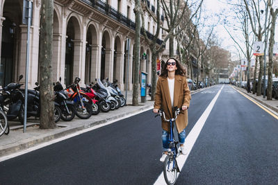 Portrait of man riding motorcycle on road