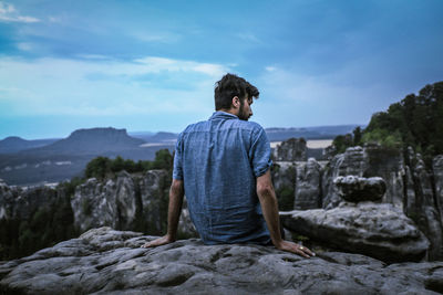 Man standing on rock formation