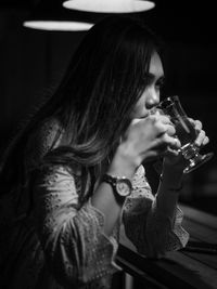 Portrait of woman drinking coffee