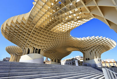 Low angle view of historical building against blue sky