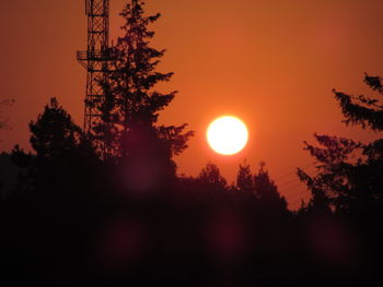 Silhouette trees against sky during sunset