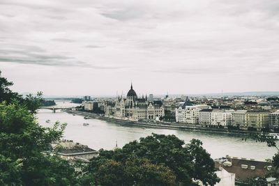 High angle view of bridge over river against cloudy sky