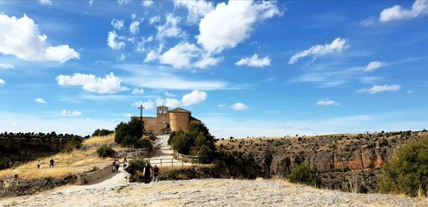 Panoramic view of castle on field against sky