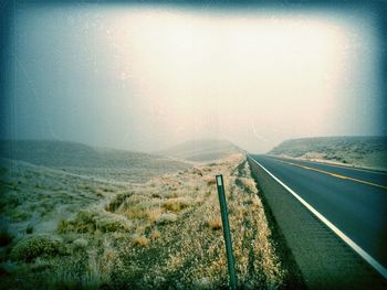 Country road passing through landscape