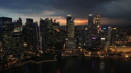 Aerial view of city lit up at night