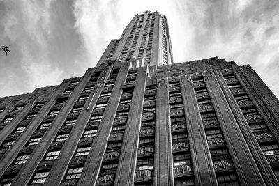 Low angle view of building against cloudy sky