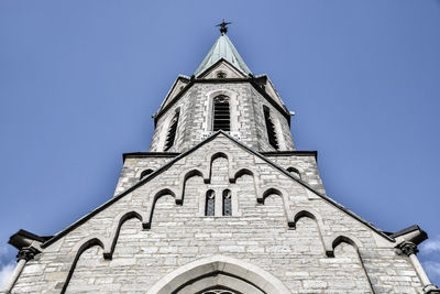 Low angle view of bell tower against sky