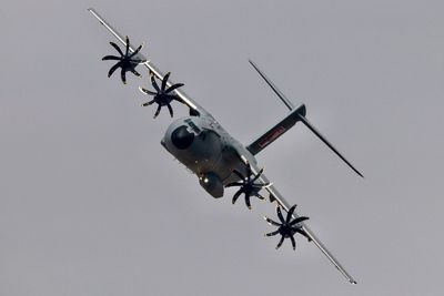 Low angle view of airplane flying in sky