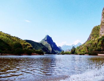 Scenic view of lake with mountains in background