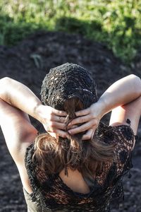 Close-up of hand by water