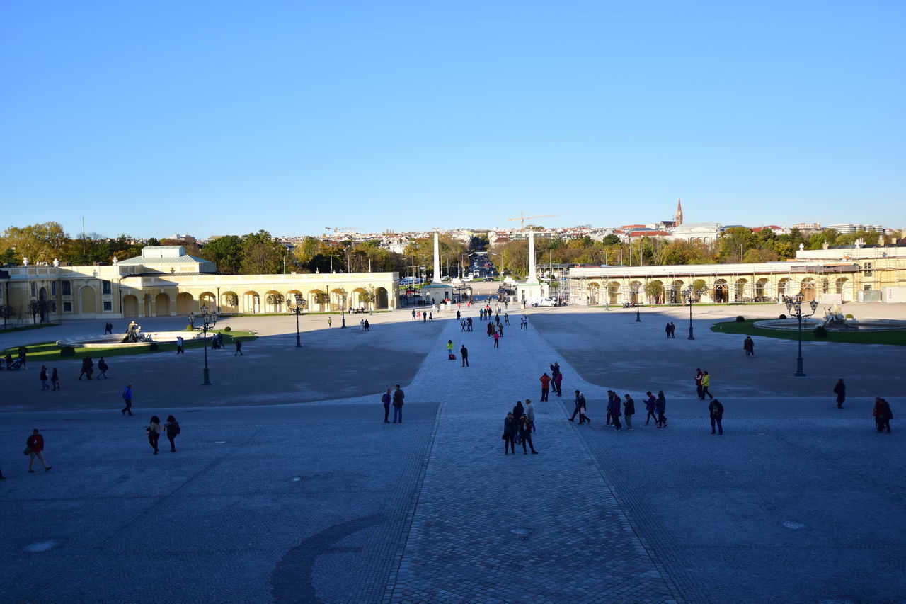 PEOPLE ON BEACH AGAINST CLEAR BLUE SKY