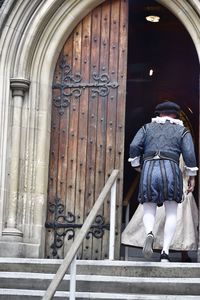 Rear view of man on steps