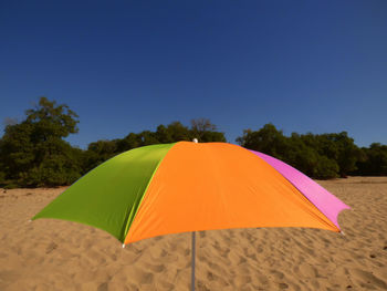 Colofrul sunshade on sandy beach