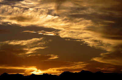 Scenic view of mountains at sunset