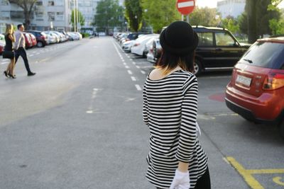 Woman walking on road