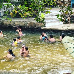 People swimming in lake