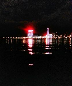 Reflection of illuminated buildings in water