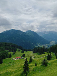 Scenic view of landscape and mountains against sky