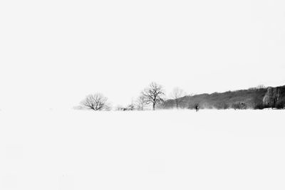 Scenic view of snow field against clear sky