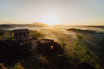 Scenic view of landscape against sky during sunset