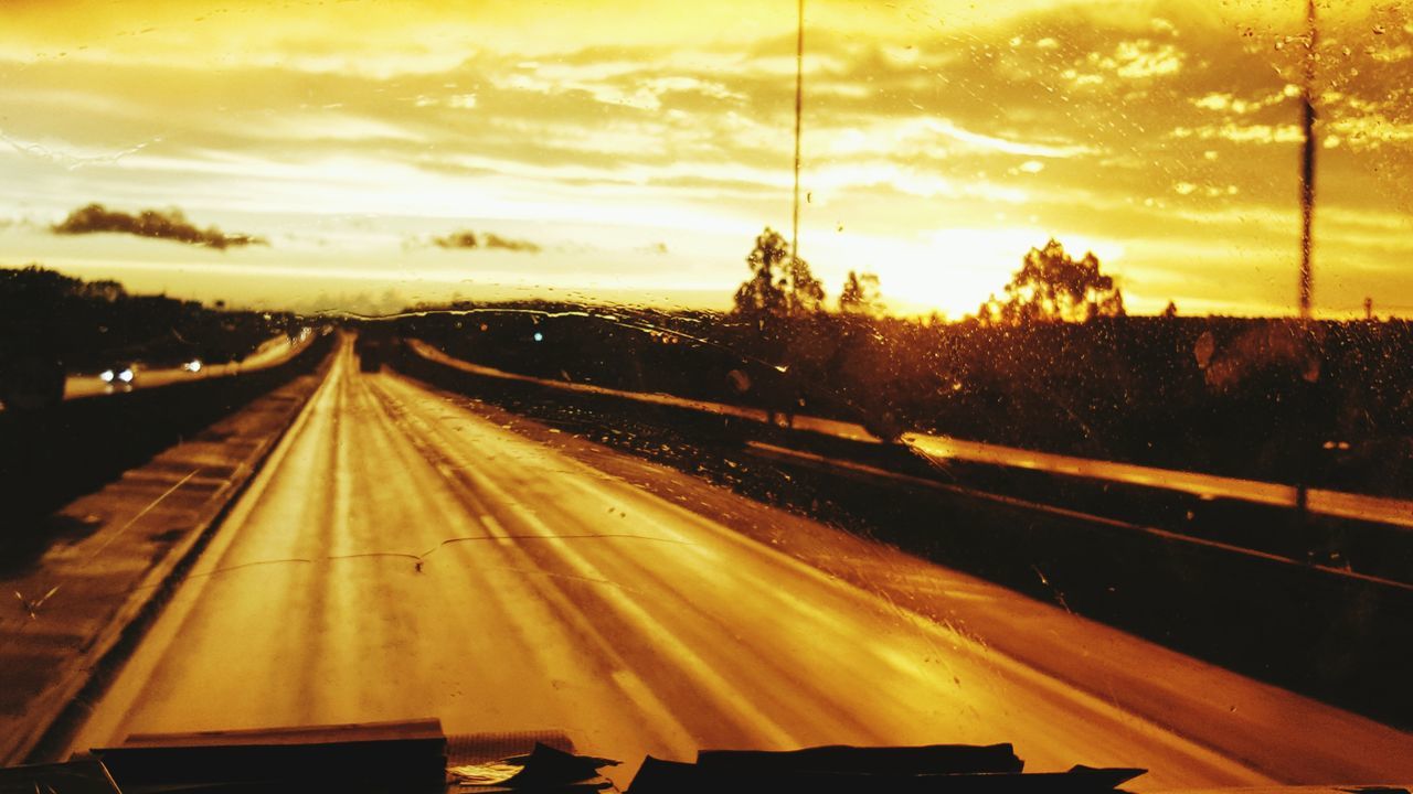 ROAD AGAINST SKY AT SUNSET