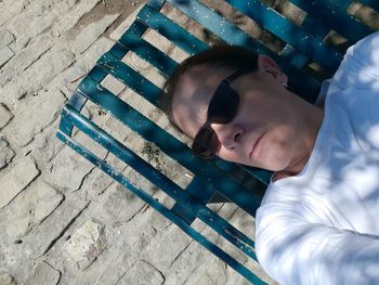 High angle view of boy lying on floor